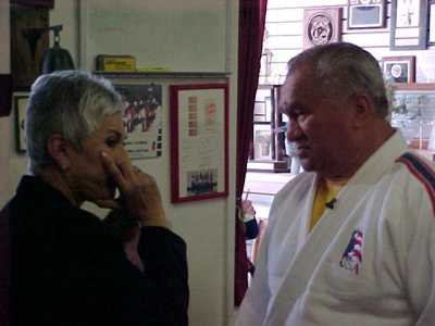 Coach Willy Cahill talking with reporter Ysabel Duran at blind judo kids clinic, KRON 4 News Taping - April 2004