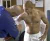 Judo Paralympian, coach taping arm at Cahill's Judo Academy